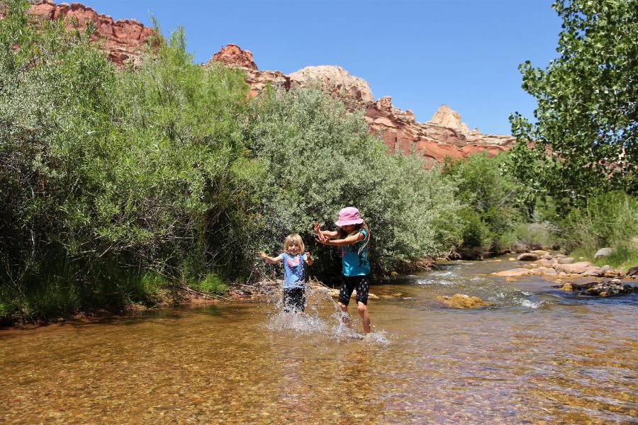Kids enjoying the Fremont River at a Fruita Campground river access point.