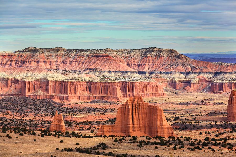 Colorful Cathedral Valley in Capitol Reef National Park with striking red rock formations and desert landscape.