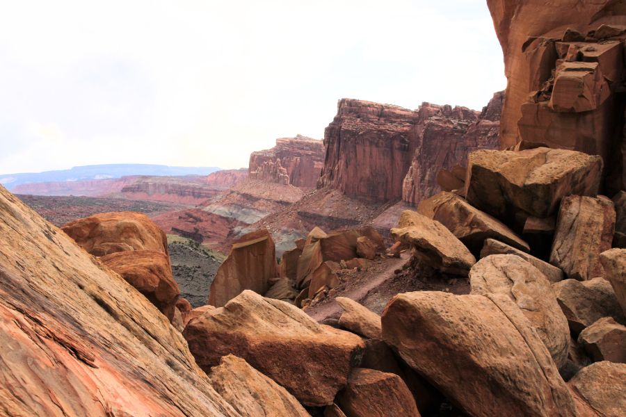 Looking back along the Cohab Canyon Trail in Capitol Reef National Park, Utah—barren rocky landscape and sandy terrain short after the initial steep switchbacks.