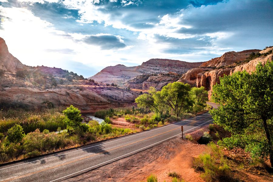 Highway 24 near Capitol Reef National Park with colorful landscape and a roadside camping pullout.