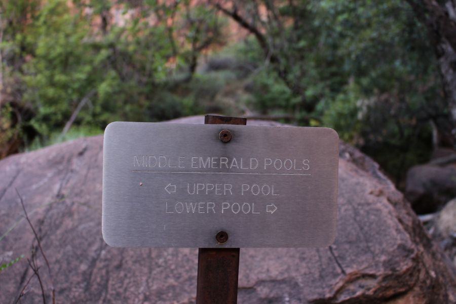 Trail sign at Middle Emerald Pools junction pointing toward Upper Pool and Lower Pool.