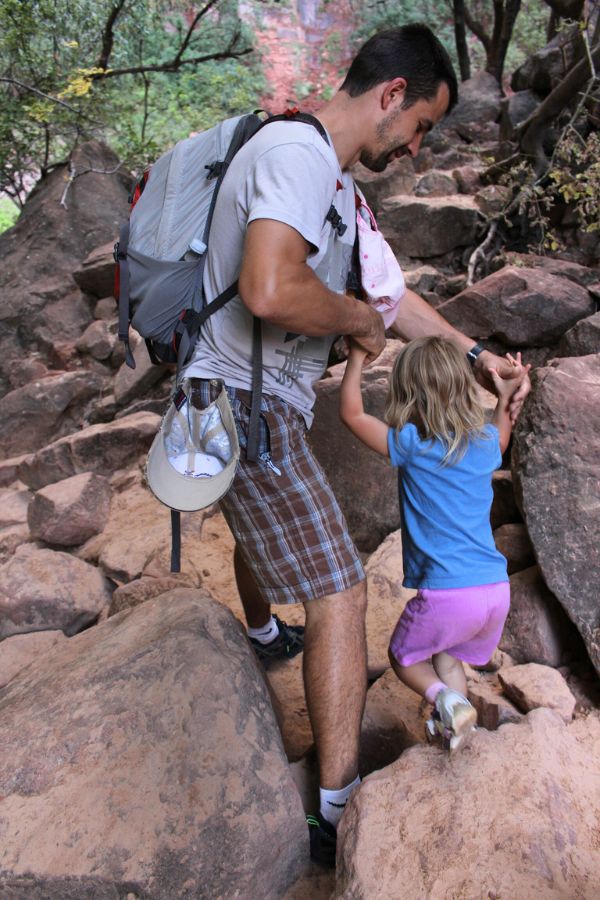Family crossing a boulder-filled section just before reaching Upper Emerald Pool.